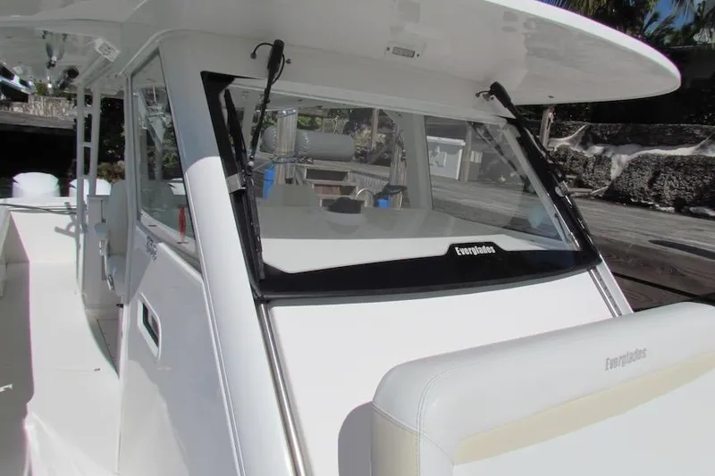 Slide: The Image of 2016 Everglades 435 Center Console boat, showcasing sleek design and spacious deck. - 14