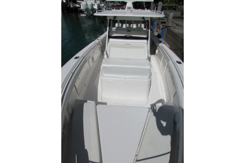Slide: The Image of 2016 Everglades 435 Center Console boat with spacious seating and sleek design. - 16