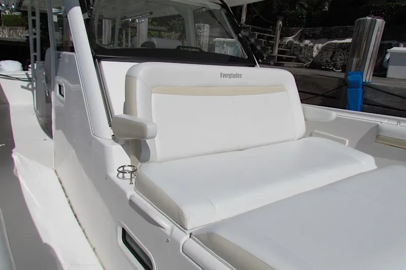 Slide: The Image of 2016 Everglades 435 Center Console boat with white seating and sleek design. - 22
