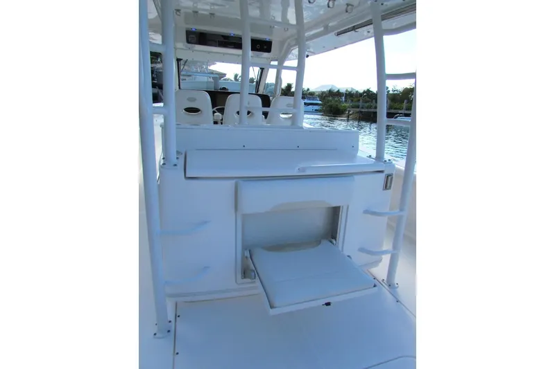 Slide: The Image of 2016 Everglades 435 Center Console boat interior with seating and storage. - 23