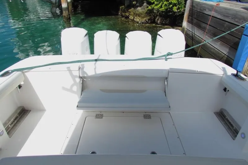 Slide: The Image of 2016 Everglades 435 Center Console boat interior with seating and outboard motors. - 26