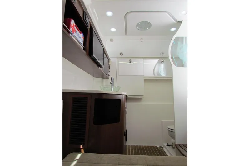 Slide: The Image of Interior of 2016 Everglades 435 Center Console boat, featuring modern amenities and sleek design. - 35