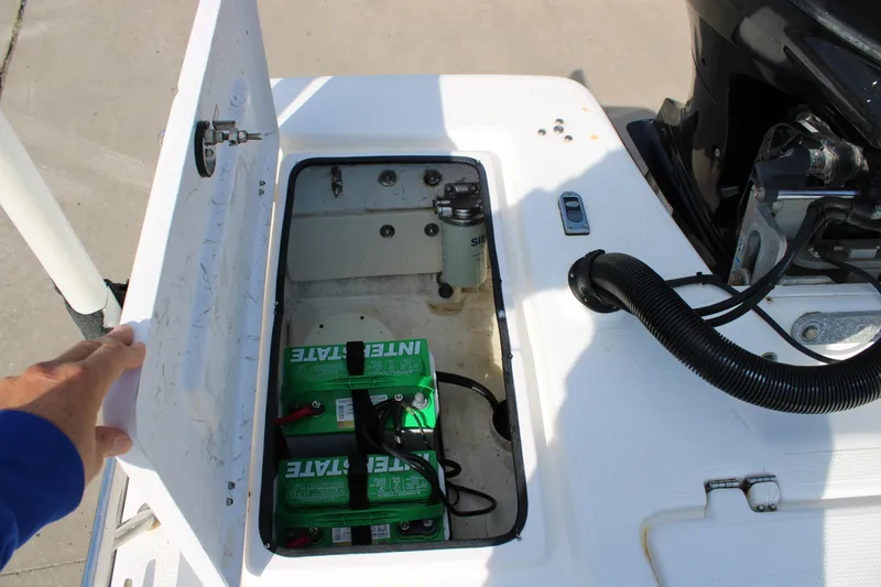Slide: The Image of Open battery compartment of 2011 Blue Wave 2200 STL boat, showing Interstate batteries. - 18