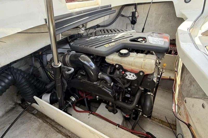 Slide: The Image of Engine compartment of a 2004 Cobalt 250 boat, featuring a MerCruiser engine. - 9