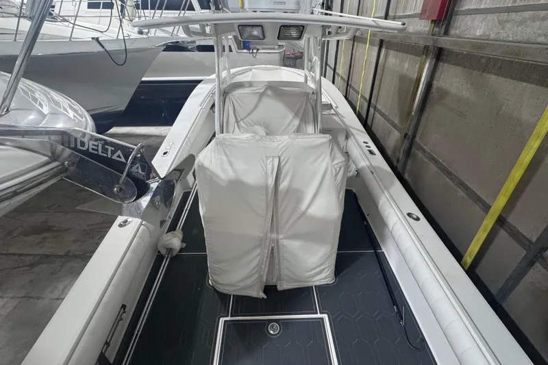 Slide: The Image of 2010 Regulator 34SS boat with covered console, docked indoors. - 10