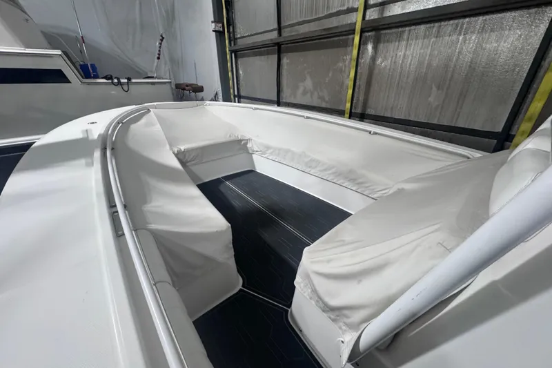 Slide: The Image of 2010 Regulator 34SS boat interior with white seating and sleek design. - 12