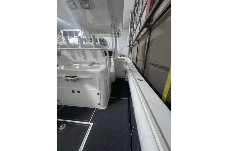 Slide: The Image of 2010 Regulator 34SS boat interior with sleek white seating and modern design. - 18