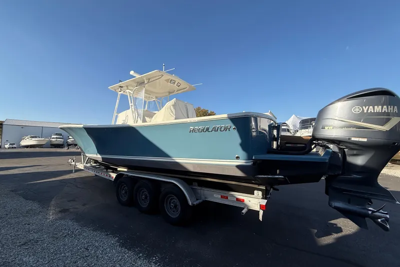 Slide: The Image of 2010 Regulator 34SS boat on trailer with Yamaha outboard motor. - 2