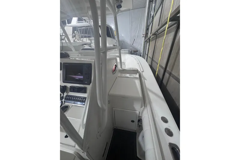 Slide: The Image of 2010 Regulator 34SS boat interior with control panel and seating area. - 21