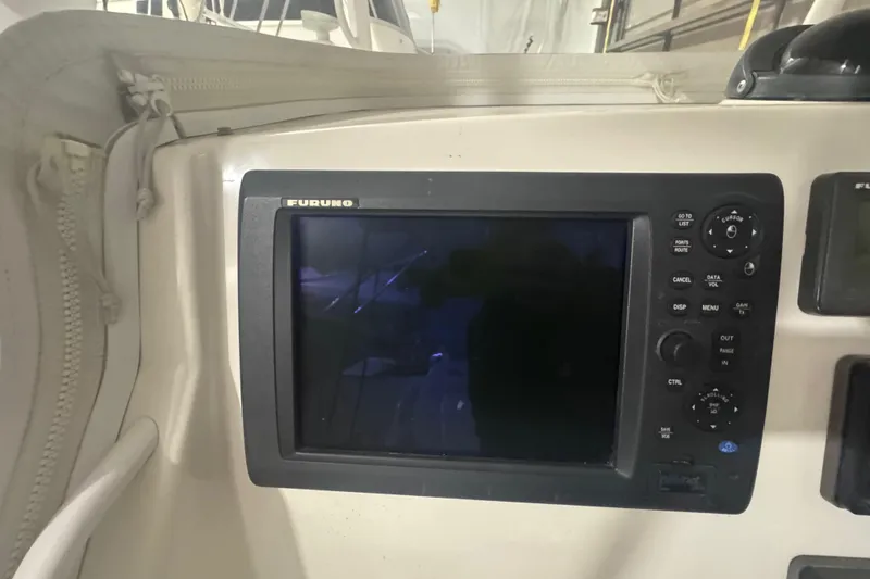 Slide: The Image of Furuno navigation system on 2010 Regulator 34SS boat dashboard. - 26