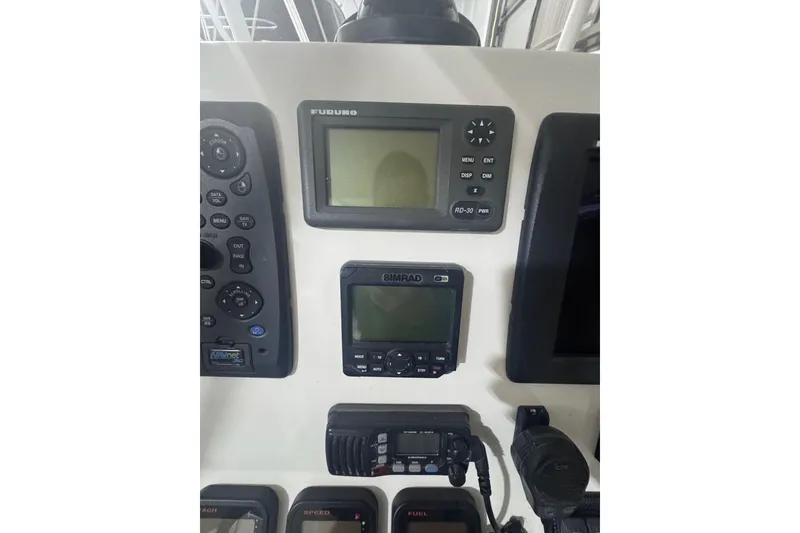 Slide: The Image of Control panel of a 2010 Regulator 34SS boat with navigation equipment. - 27