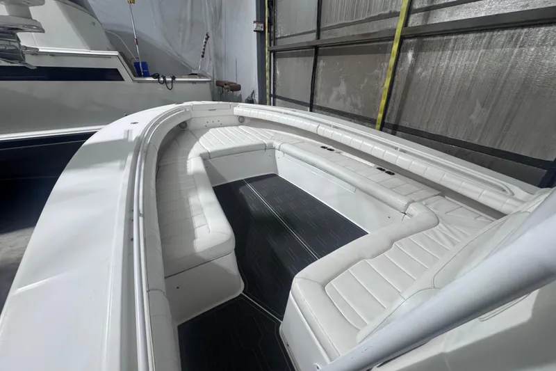 Slide: The Image of 2010 Regulator 34SS boat interior with white seating and sleek design. - 32