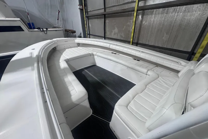 Slide: The Image of 2010 Regulator 34SS boat interior with white seating and sleek design. - 33