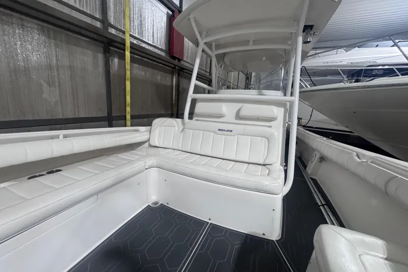 Slide: The Image of 2010 Regulator 34SS boat interior with white seating and modern design. - 38