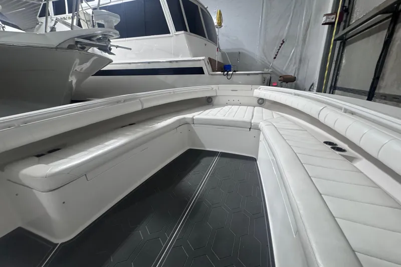 Slide: The Image of 2010 Regulator 34SS boat interior with white seating and hexagonal floor pattern. - 40