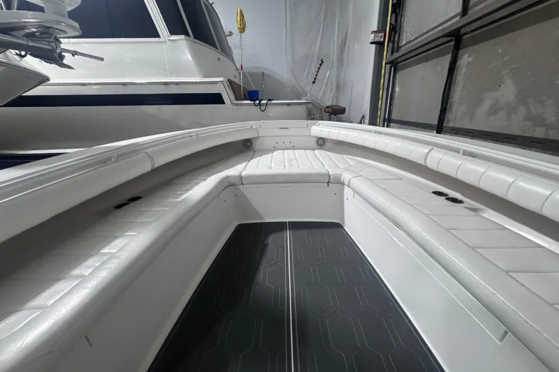 Slide: The Image of 2010 Regulator 34SS boat interior with white seating and dark flooring. - 41