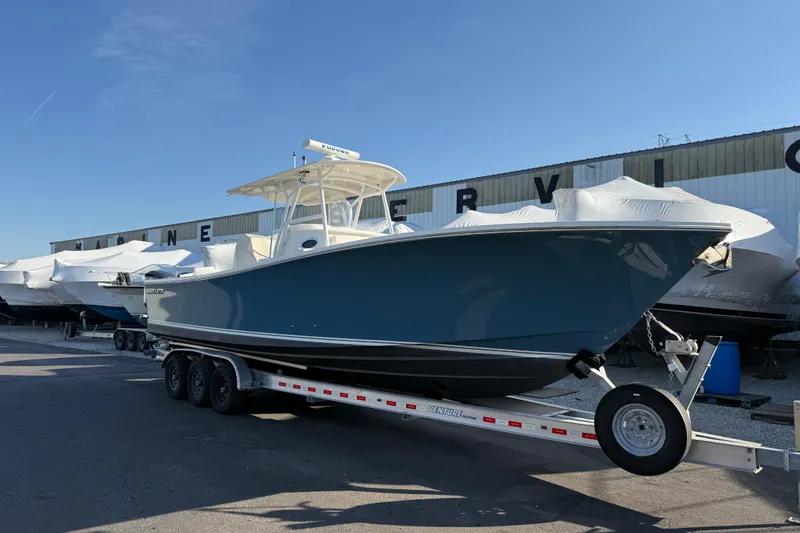 Slide: The Image of 2010 Regulator 34SS boat on trailer at marine service facility. - 5