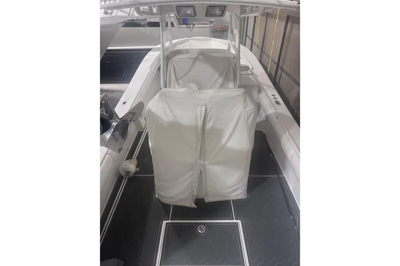 Slide: The Image of 2010 Regulator 34SS boat interior with covered seating and sleek design. - 9