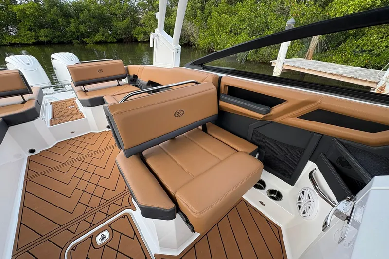 Slide: The Image of 2026 Cobalt R8 Outboard boat interior with tan leather seating and stylish flooring. - 24