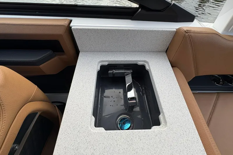 Slide: The Image of 2026 Cobalt R8 Outboard interior with built-in sink and luxurious seating. - 25