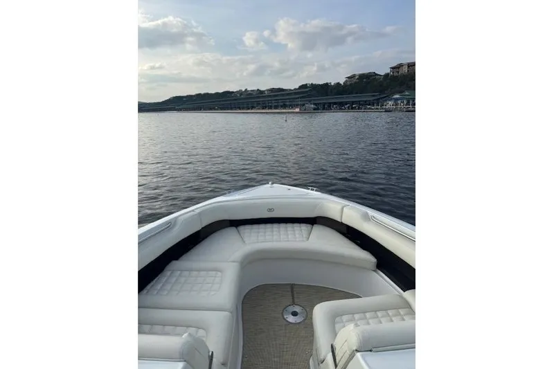 The Image of 2017 Cobalt R30 boat with white seating on a calm lake. - 1