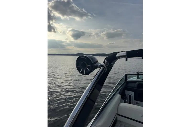 Slide: The Image of 2017 Cobalt R30 boat on calm water at sunset with speaker detail. - 9