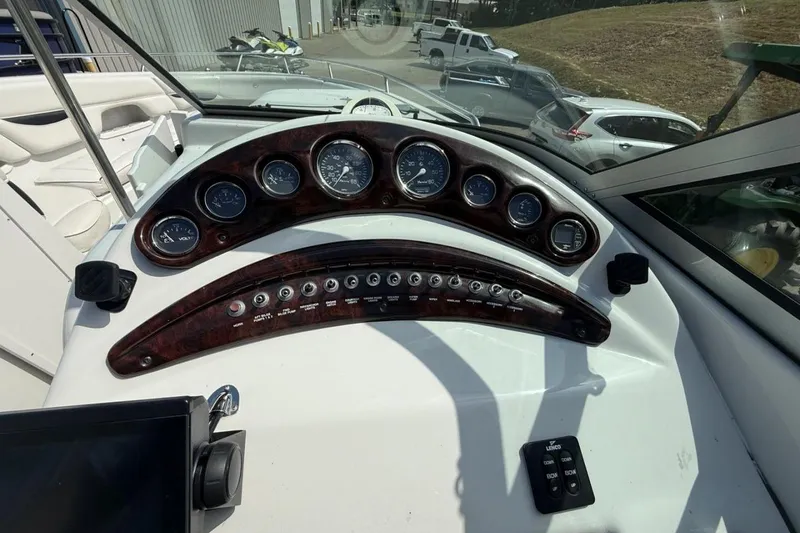 Slide: The Image of Dashboard of a 2005 Crownline 288 BR boat with gauges and controls. - 24