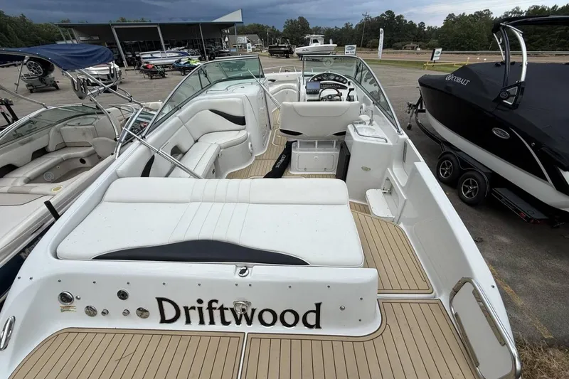 Slide: The Image of 2005 Crownline 288 BR boat named Driftwood, featuring spacious seating and sleek design. - 8