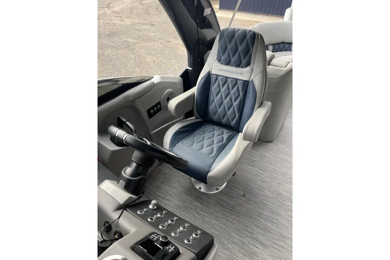 Slide: The Image of Luxurious interior of 2021 Bennington 27 QXFBWAX2 boat with plush captain's chair. - 10