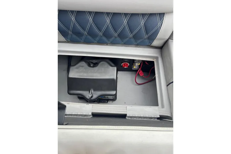 Slide: The Image of Battery compartment of 2021 Bennington 27 QXFBWAX2 boat with wiring and switch. - 5