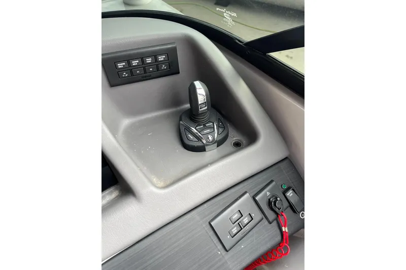 Slide: The Image of Control panel of 2021 Bennington 27 QXFBWAX2 boat with joystick and switches. - 8