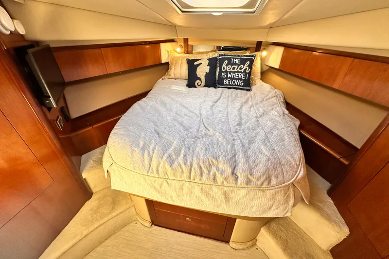 Slide: The Image of Cozy bedroom in 2005 Sea Ray 420 Sedan Bridge yacht with nautical decor. - 16