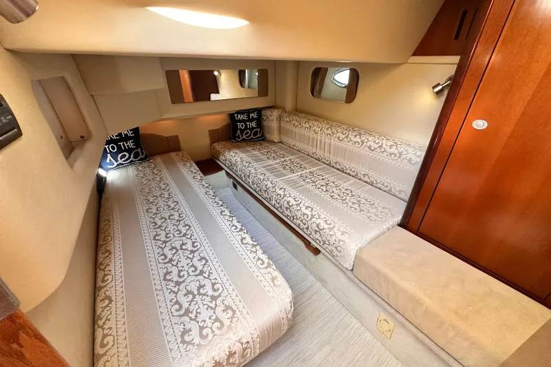 Slide: The Image of Luxurious cabin interior of 2005 Sea Ray 420 Sedan Bridge with elegant bedding. - 18