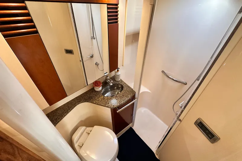 Slide: The Image of Luxurious bathroom in 2005 Sea Ray 420 Sedan Bridge yacht with shower and sink. - 19