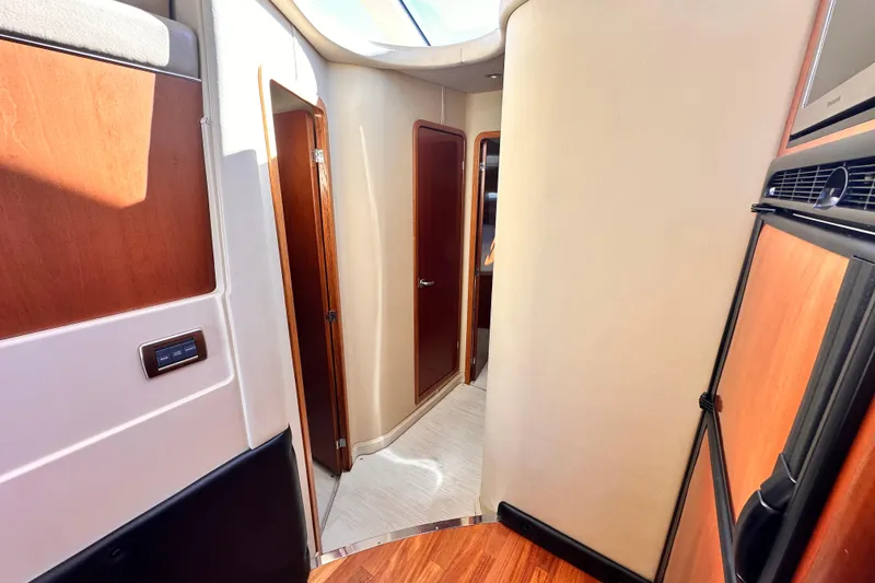 Slide: The Image of Interior of 2005 Sea Ray 420 Sedan Bridge yacht, featuring wood paneling and modern design. - 20