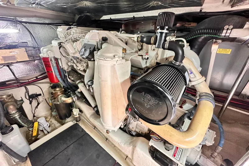 Slide: The Image of Engine room of a 2005 Sea Ray 420 Sedan Bridge yacht, showcasing detailed machinery. - 25