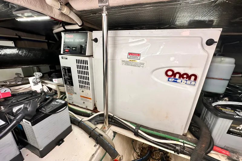 Slide: The Image of Engine room of 2005 Sea Ray 420 Sedan Bridge with Onan marine generator. - 26