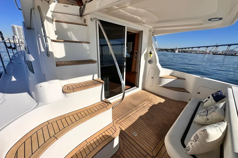 Slide: The Image of 2005 Sea Ray 420 Sedan Bridge yacht with teak deck and elegant seating area. - 4