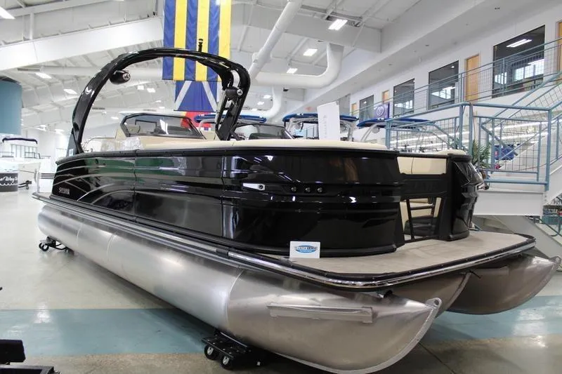 The Image of 2024 Sylvan G5 CLZ DC pontoon boat displayed in a showroom. - 1