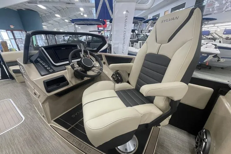 Slide: The Image of 2024 Sylvan G5 CLZ DC boat interior with modern helm and luxurious captain's chair. - 11
