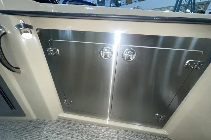 Slide: The Image of 2024 Sylvan G5 CLZ DC boat storage compartment with stainless steel doors. - 13
