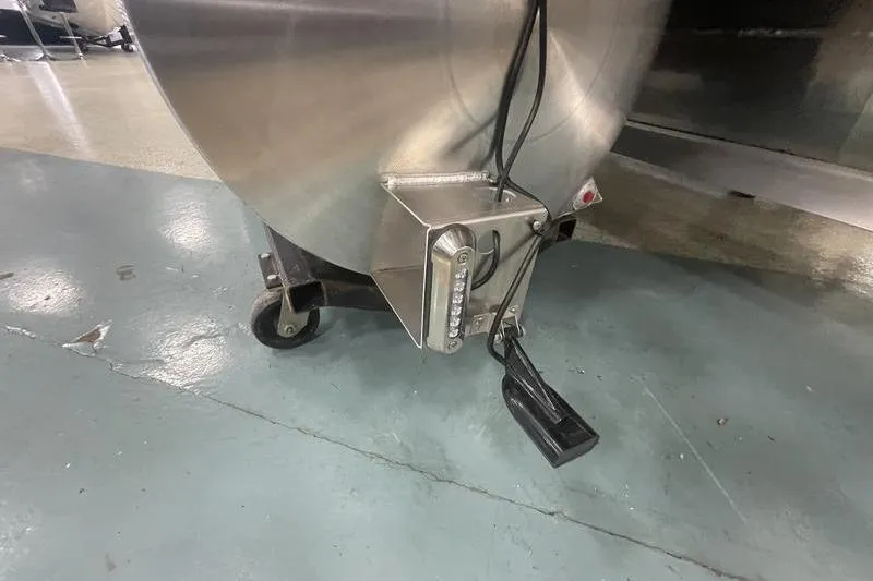 Slide: The Image of 2024 Sylvan G5 CLZ DC trailer hitch with caster wheel on concrete floor. - 23