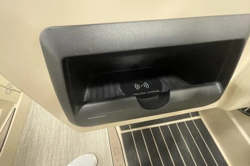 Slide: The Image of 2024 Sylvan G5 CLZ DC wireless charging compartment, beige interior, modern design. - 9