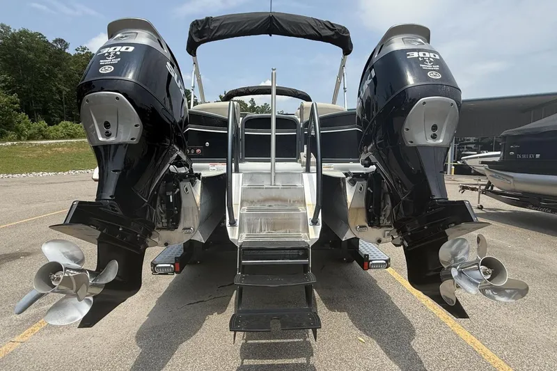 Slide: The Image of 2021 Premier 270 S-Series RF boat with dual outboard motors, parked outdoors. - 10
