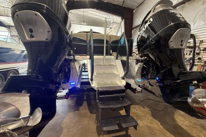 Slide: The Image of 2021 Premier 270 S-Series RF boat with dual Suzuki outboard motors in a showroom. - 11