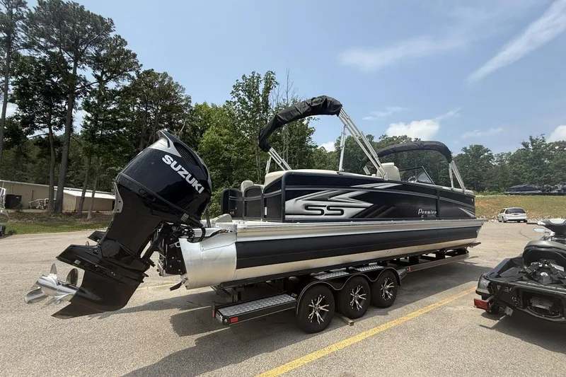 Slide: The Image of 2021 Premier 270 S-Series RF pontoon boat with Suzuki outboard motor on trailer. - 26