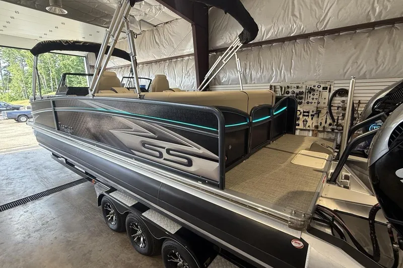Slide: The Image of 2021 Premier 270 S-Series RF pontoon boat in a garage setting. - 27