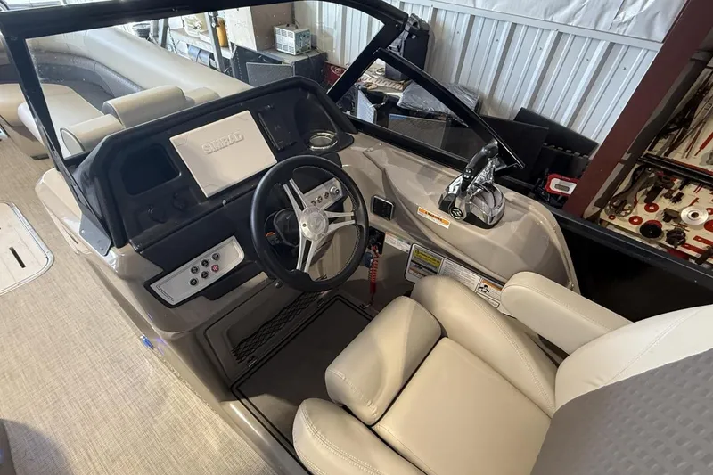 Slide: The Image of 2021 Premier 270 S-Series RF boat interior with steering wheel and control panel. - 7