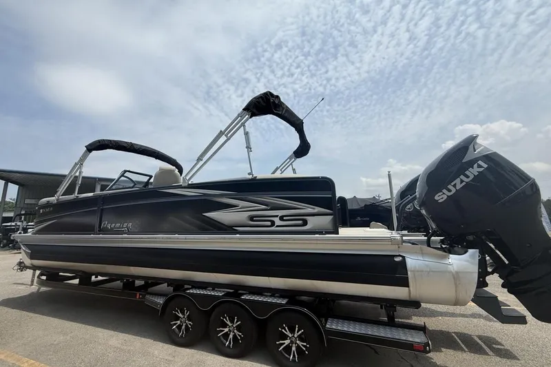 Slide: The Image of 2021 Premier 270 S-Series RF pontoon boat with Suzuki outboard motor on trailer. - 9