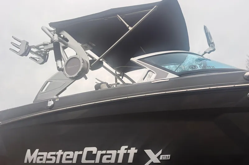 Slide: The Image of 2019 MasterCraft XStar boat with sleek design and advanced wakeboard tower. - 12